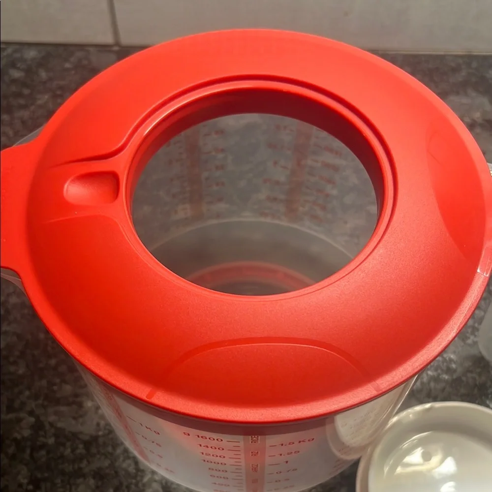 Tupperware Mix n Store Red and White Measuring cup. New without tags